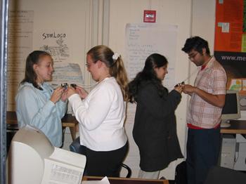 Students perform a genetics experiment by "mating"
