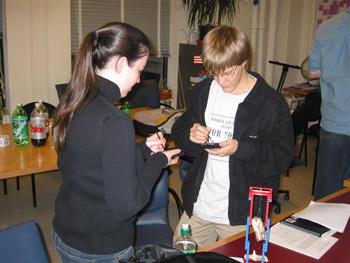 Students particpate in the same simulation using the Palm pilot version of the exercise.