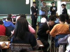 Observers line the classroom