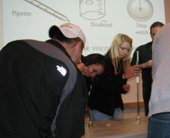 Students participate in testing the viscosity of vegetable oil, diesel fuel, and biodiesel.